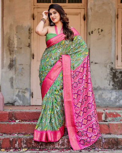 Green and Pink Tussar Silk Saree with Vibrant Ikat Patterns and Zari Border