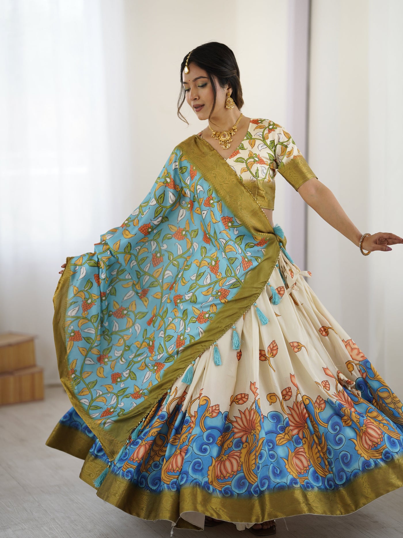 Off-White & Blue Kalamkari Silk Lehenga with Olive Zari Border & Tassel Dupatta – Festive & Wedding Wear