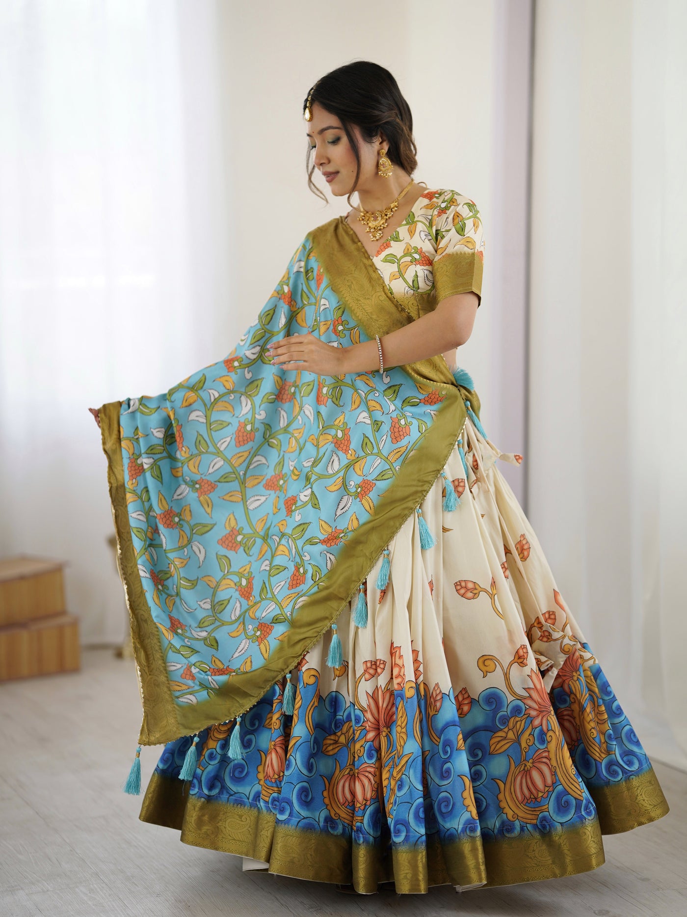 Off-White & Blue Kalamkari Silk Lehenga with Olive Zari Border & Tassel Dupatta – Festive & Wedding Wear