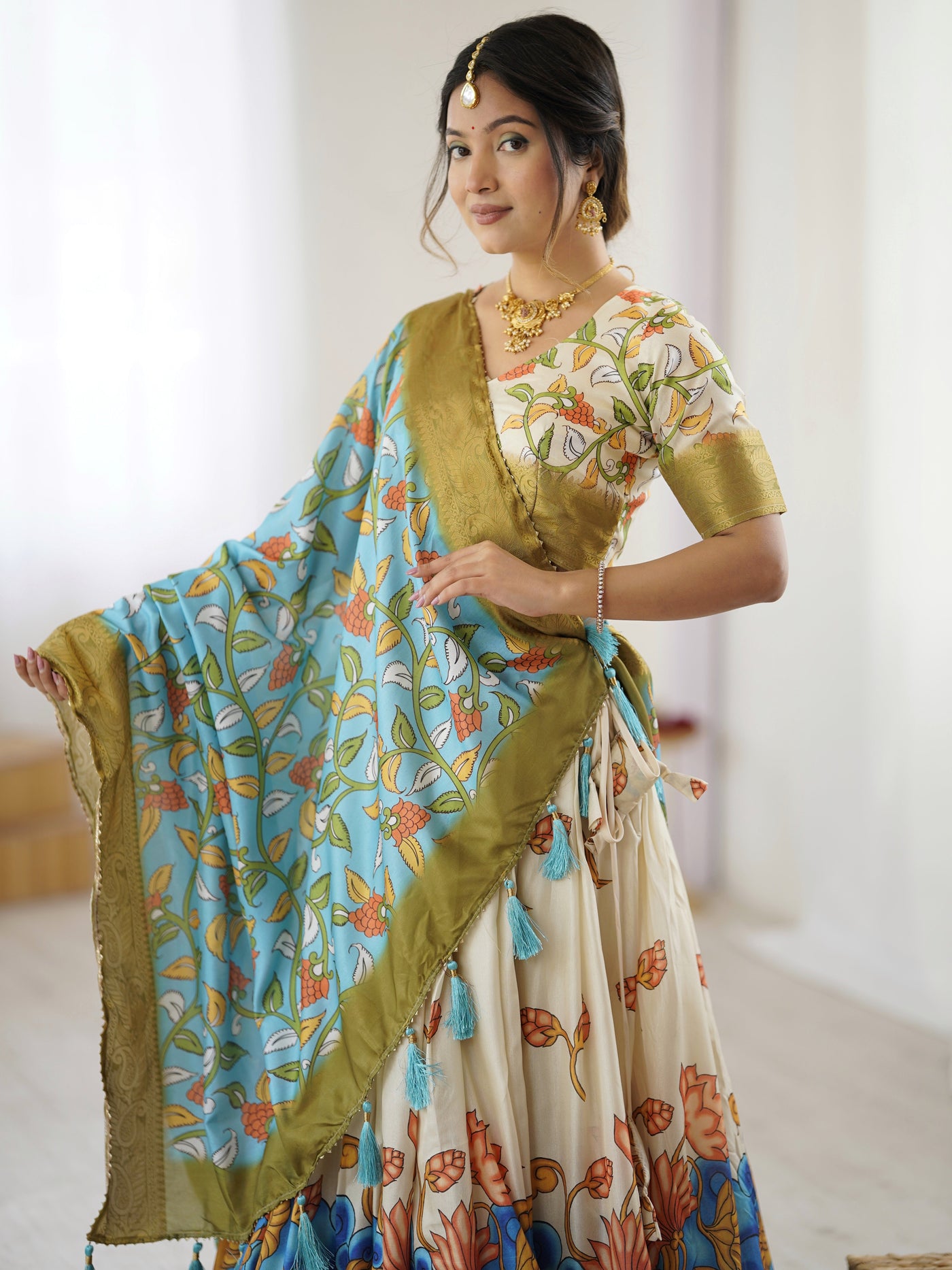 Off-White & Blue Kalamkari Silk Lehenga with Olive Zari Border & Tassel Dupatta – Festive & Wedding Wear