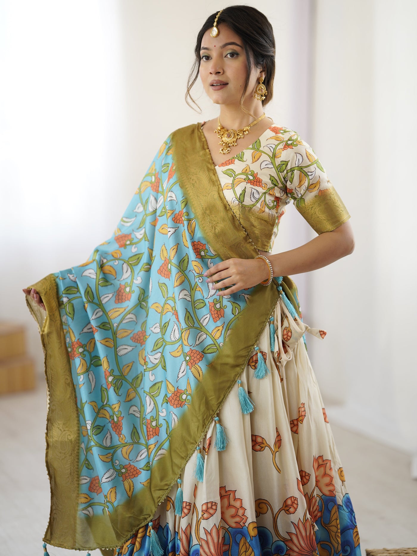 Off-White & Blue Kalamkari Silk Lehenga with Olive Zari Border & Tassel Dupatta – Festive & Wedding Wear