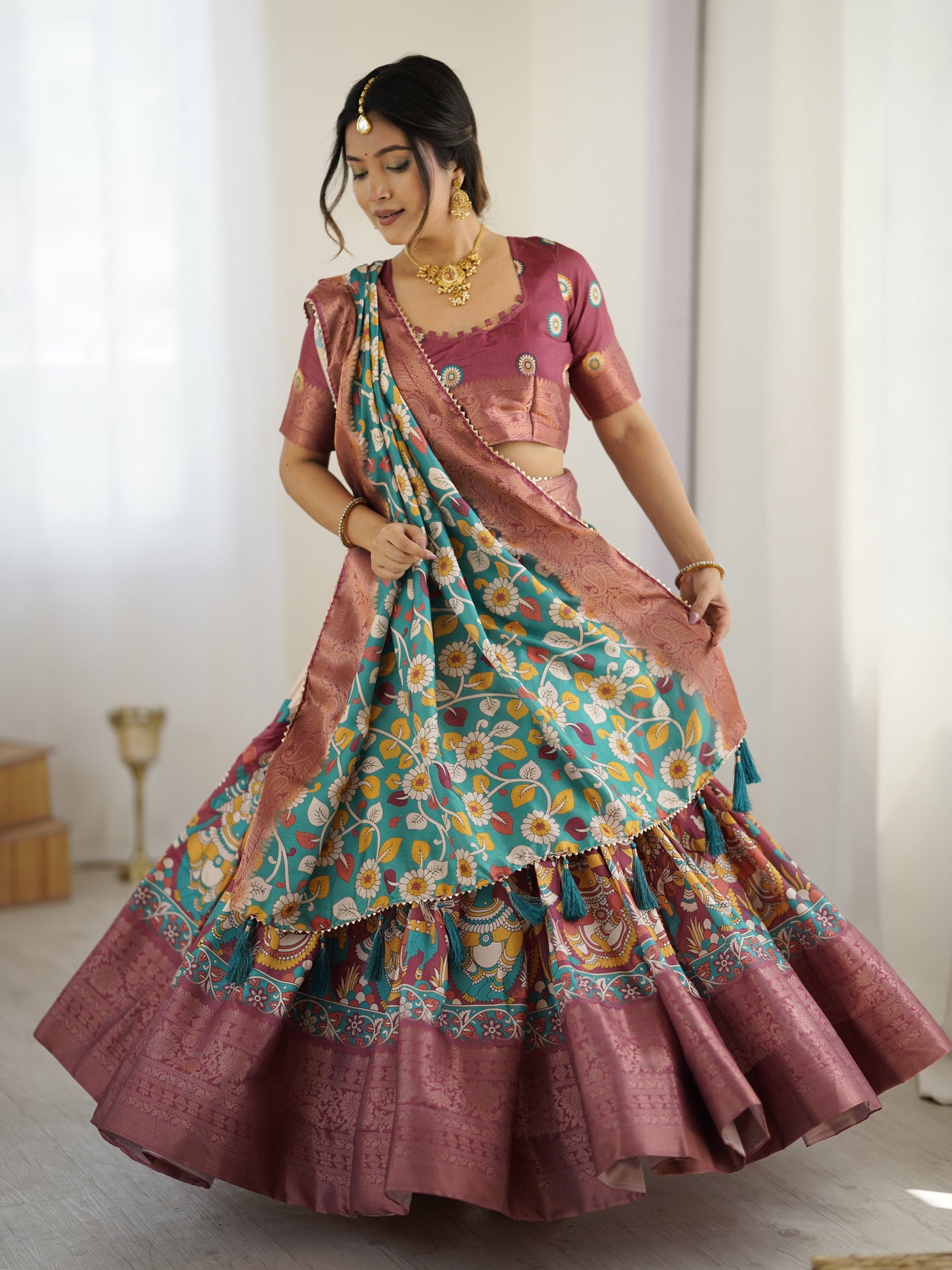 Wine & Turquoise Kalamkari Tussar Silk Lehenga with Floral Motifs, Zari Border & Tassel Dupatta – Wedding & Festive Wear