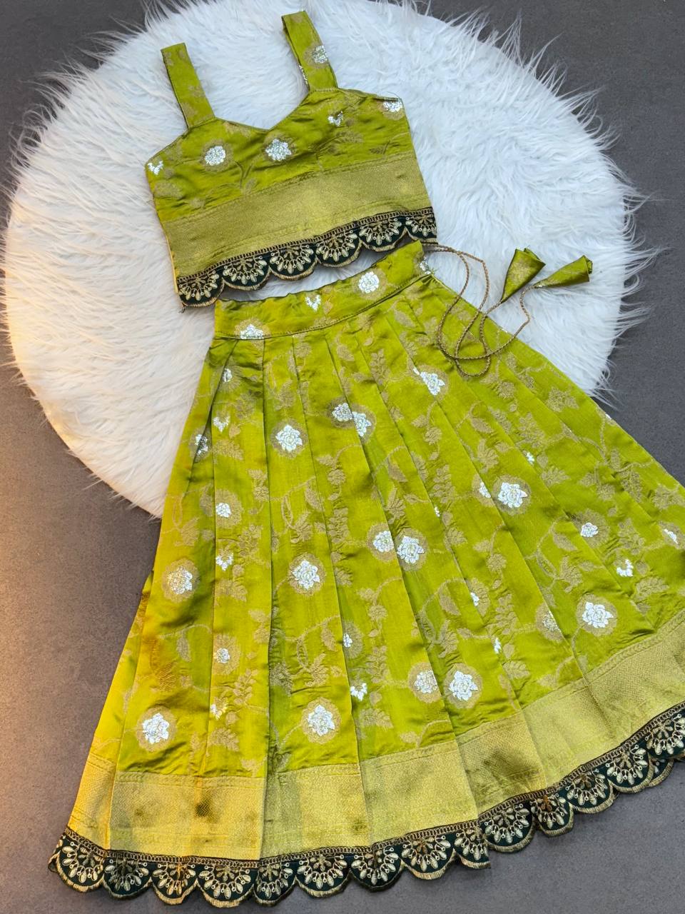 Olive Green Silk Kids Lehenga Choli with Sleeveless Blouse and Zari Embroidery Lace Border  – Festive Wear