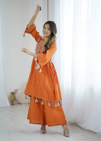 Hand-Embroidered Designer Peplum & Bell Bottom Set with Real Mirror Work Orange Kurta Set with Pink Tassels – Ethnic Festive Wear for Women