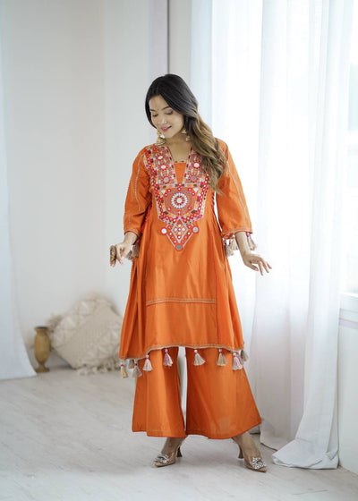 Hand-Embroidered Designer Peplum & Bell Bottom Set with Real Mirror Work Orange Kurta Set with Pink Tassels – Ethnic Festive Wear for Women