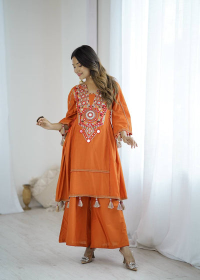 Hand-Embroidered Designer Peplum & Bell Bottom Set with Real Mirror Work Orange Kurta Set with Pink Tassels – Ethnic Festive Wear for Women