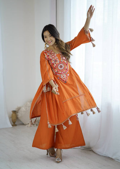 Hand-Embroidered Designer Peplum & Bell Bottom Set with Real Mirror Work Orange Kurta Set with Pink Tassels – Ethnic Festive Wear for Women