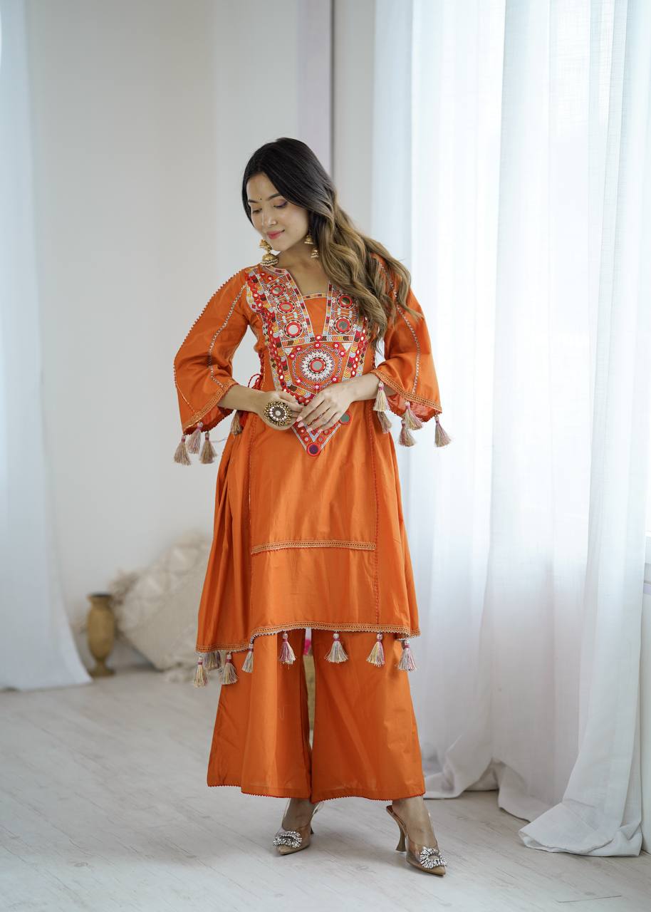 Hand-Embroidered Designer Peplum & Bell Bottom Set with Real Mirror Work Orange Kurta Set with Pink Tassels – Ethnic Festive Wear for Women