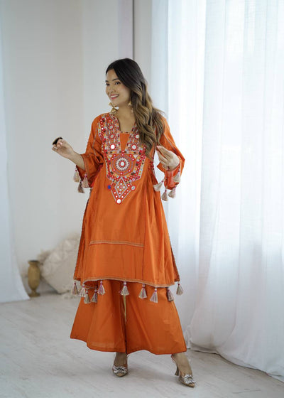 Hand-Embroidered Designer Peplum & Bell Bottom Set with Real Mirror Work Orange Kurta Set with Pink Tassels – Ethnic Festive Wear for Women