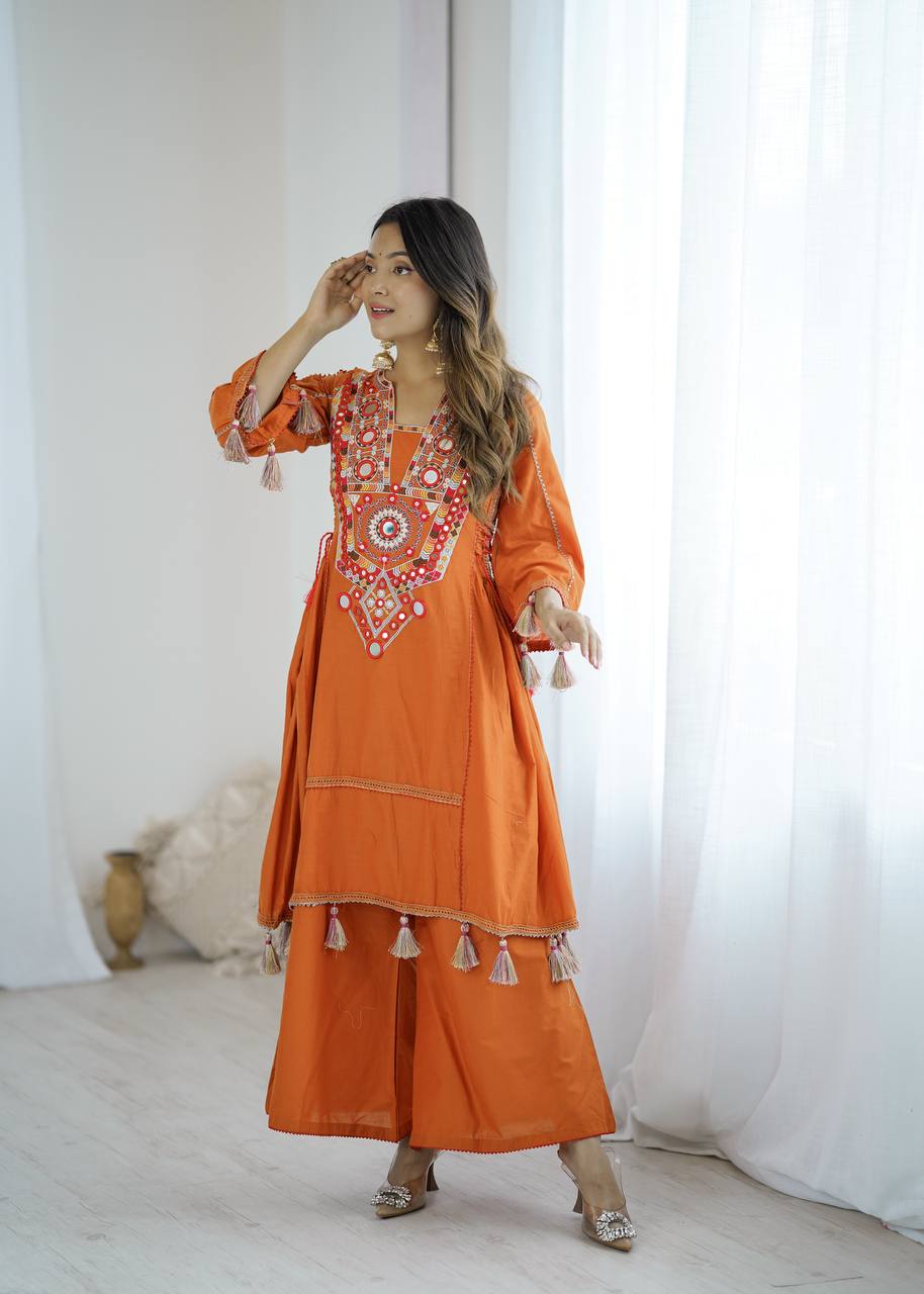 Hand-Embroidered Designer Peplum & Bell Bottom Set with Real Mirror Work Orange Kurta Set with Pink Tassels – Ethnic Festive Wear for Women