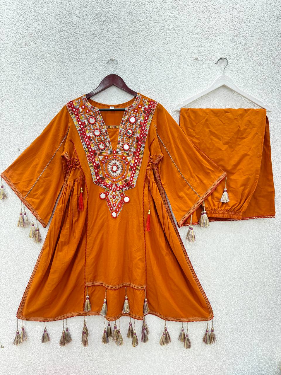 Hand-Embroidered Designer Peplum & Bell Bottom Set with Real Mirror Work Orange Kurta Set with Pink Tassels – Ethnic Festive Wear for Women