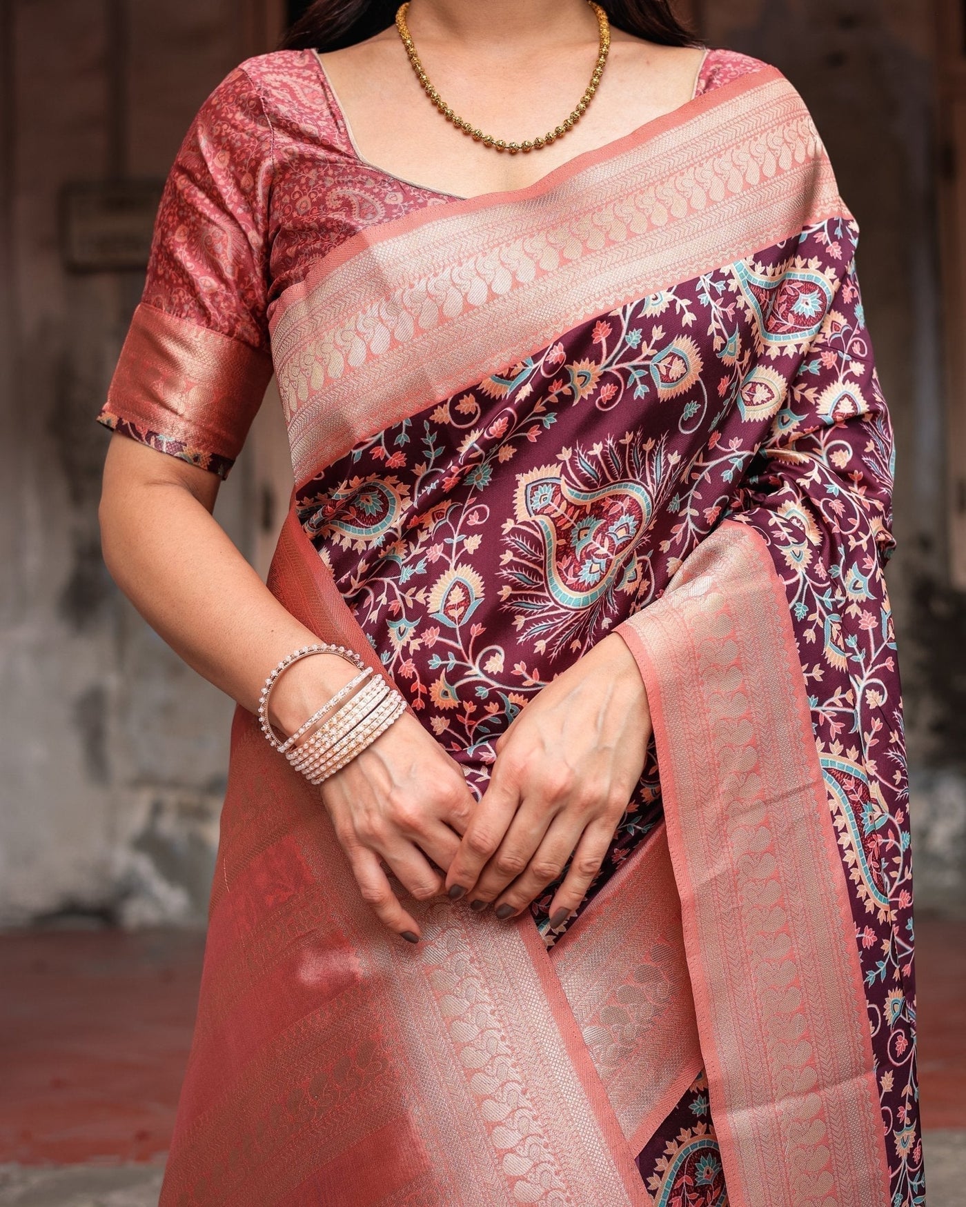 Maroon Banarasi Silk Saree with Peach Zari Border and Paisley Motifs