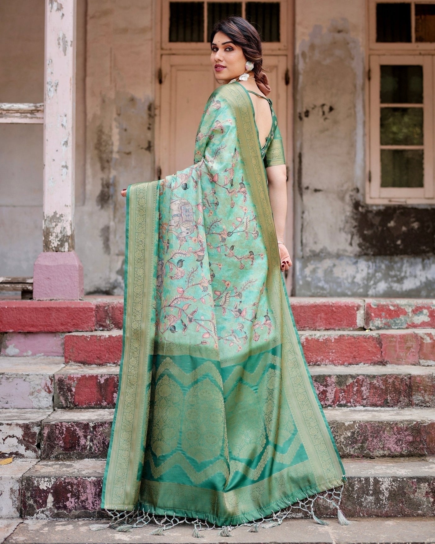 Graceful Green Banarasi Silk Saree with Intricate Floral and Elephant Weaves