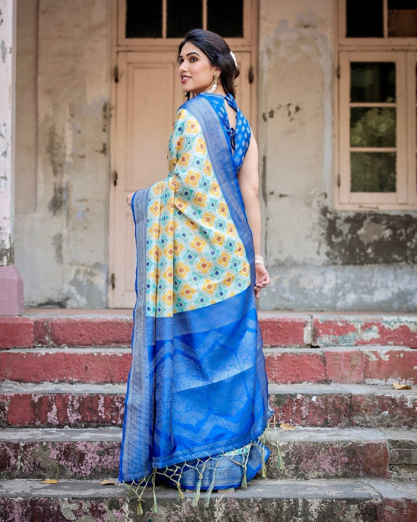 Yellow and Blue Ikat Digital Print Banarasi Silk Saree with Zari Weave and Tassel-Embellished Pallu