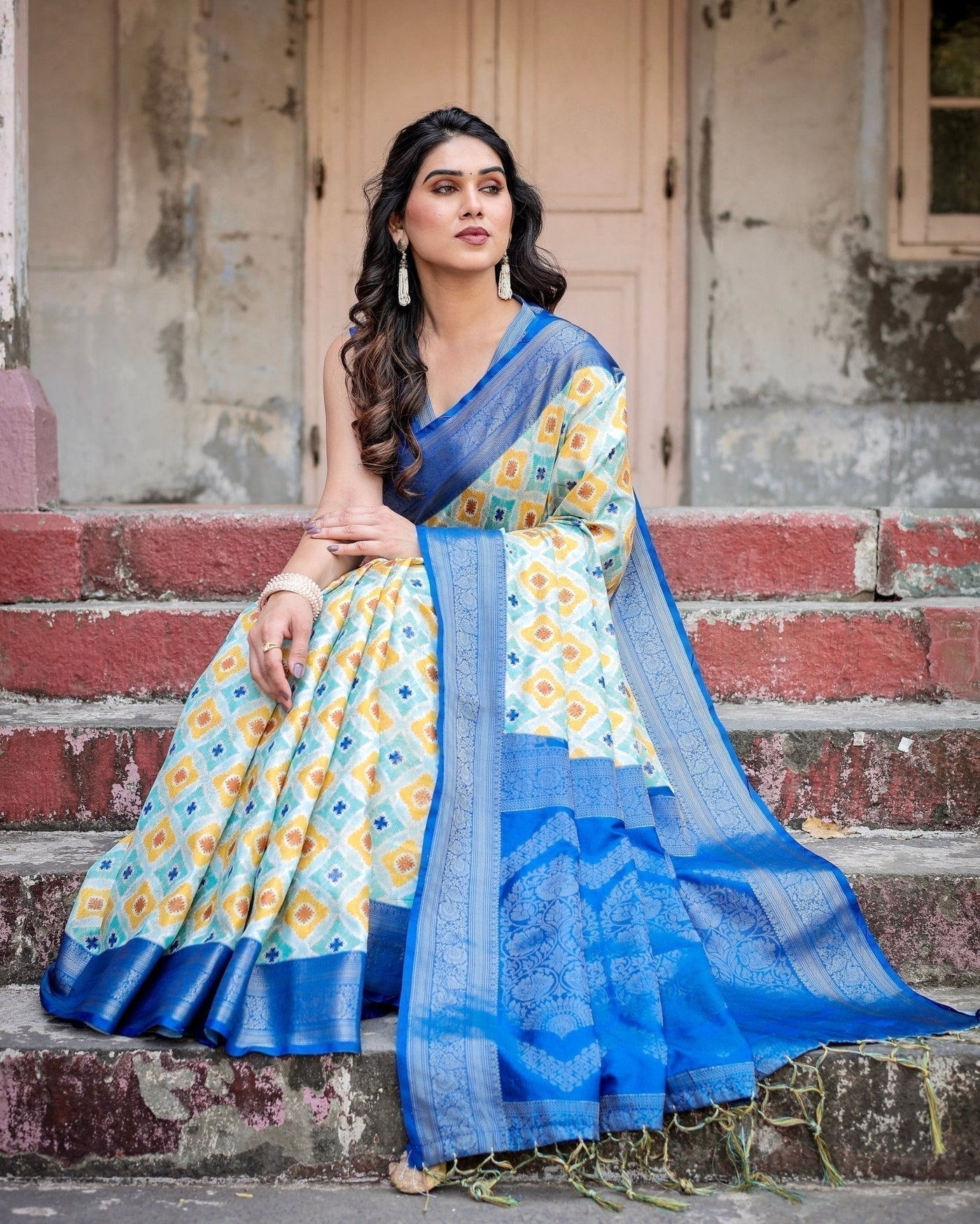 Yellow and Blue Ikat Digital Print Banarasi Silk Saree with Zari Weave and Tassel-Embellished Pallu