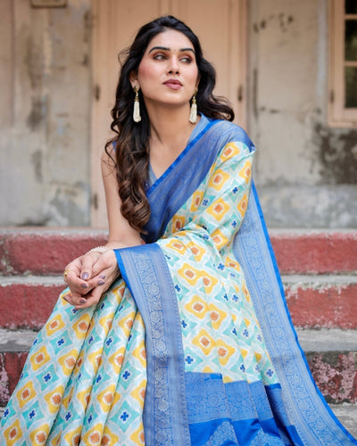Yellow and Blue Ikat Digital Print Banarasi Silk Saree with Zari Weave and Tassel-Embellished Pallu
