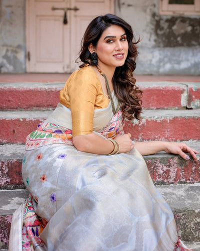 Off-White and Multicolor Mandala Design Banarasi Silk Saree with Zari Weave and Tassel-Adorned Pallu