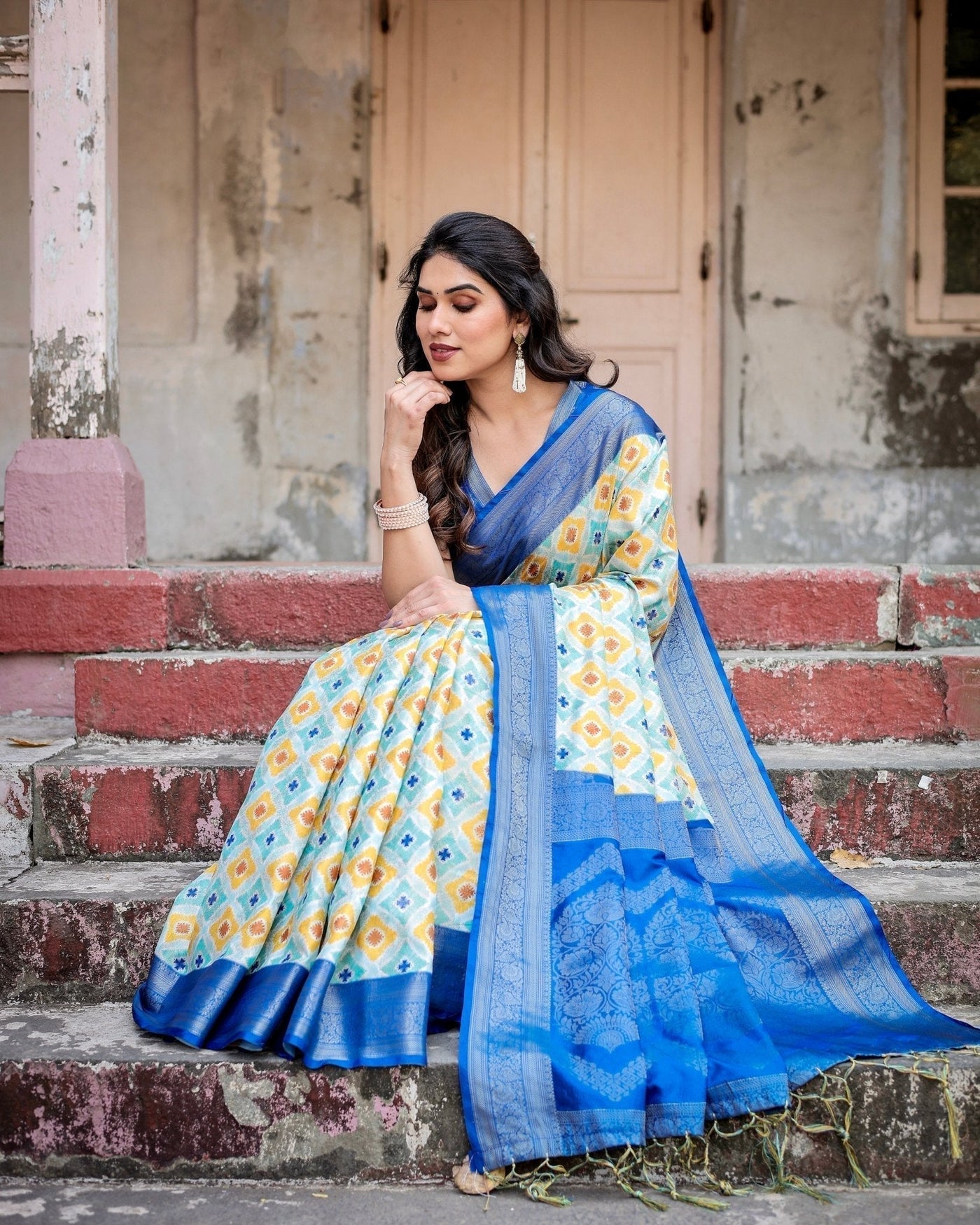 Yellow and Blue Ikat Digital Print Banarasi Silk Saree with Zari Weave and Tassel-Embellished Pallu