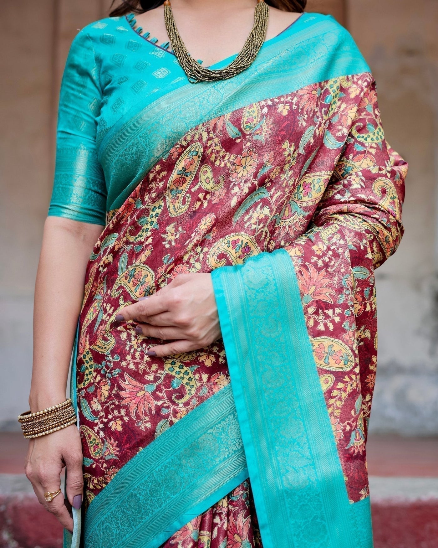 Maroon and Teal Paisley Design Banarasi Silk Saree with Zari Weave and Tassel-Embellished Pallu