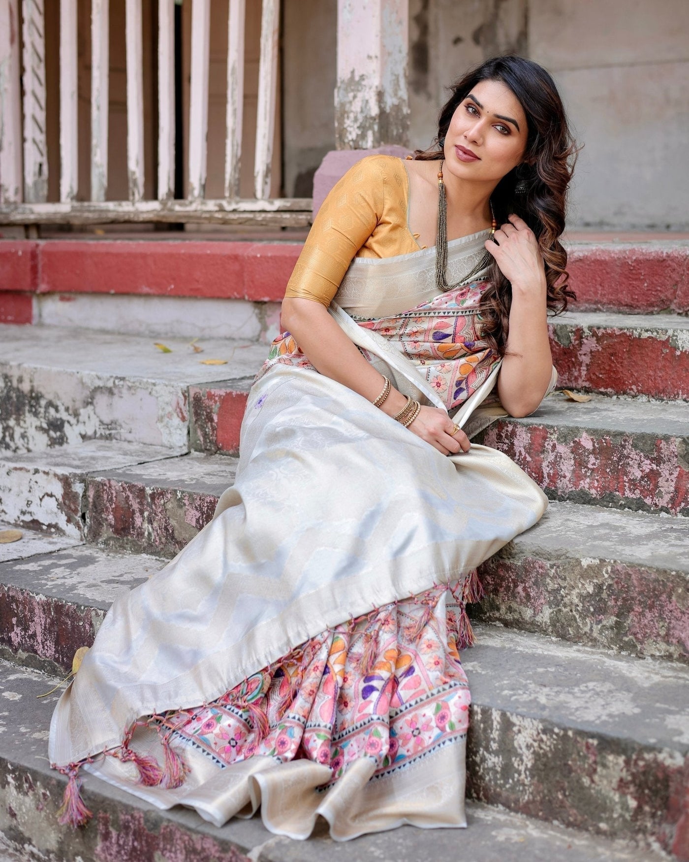 Off-White and Multicolor Mandala Design Banarasi Silk Saree with Zari Weave and Tassel-Adorned Pallu