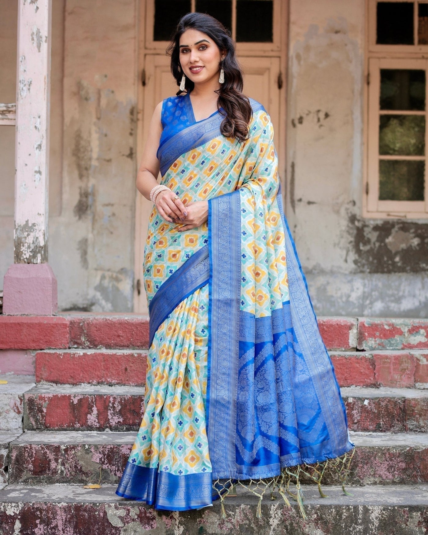 Yellow and Blue Ikat Digital Print Banarasi Silk Saree with Zari Weave and Tassel-Embellished Pallu