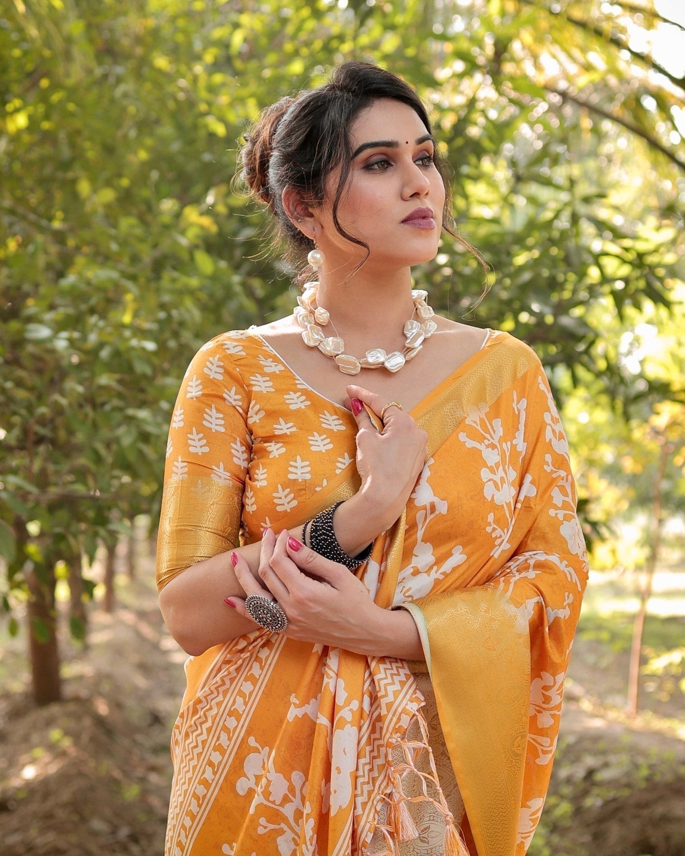 Sunshine Yellow Tussar Silk Saree with White Floral Motifs, Lustrous Zari Border, and Graceful Tassel Pallu
