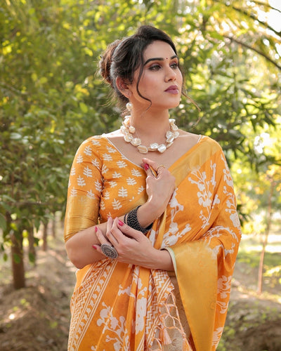 Sunshine Yellow Tussar Silk Saree with White Floral Motifs, Lustrous Zari Border, and Graceful Tassel Pallu