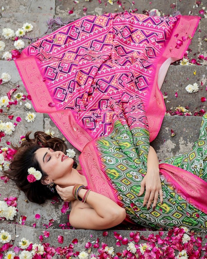 Green and Pink Tussar Silk Saree with Vibrant Ikat Patterns and Zari Border