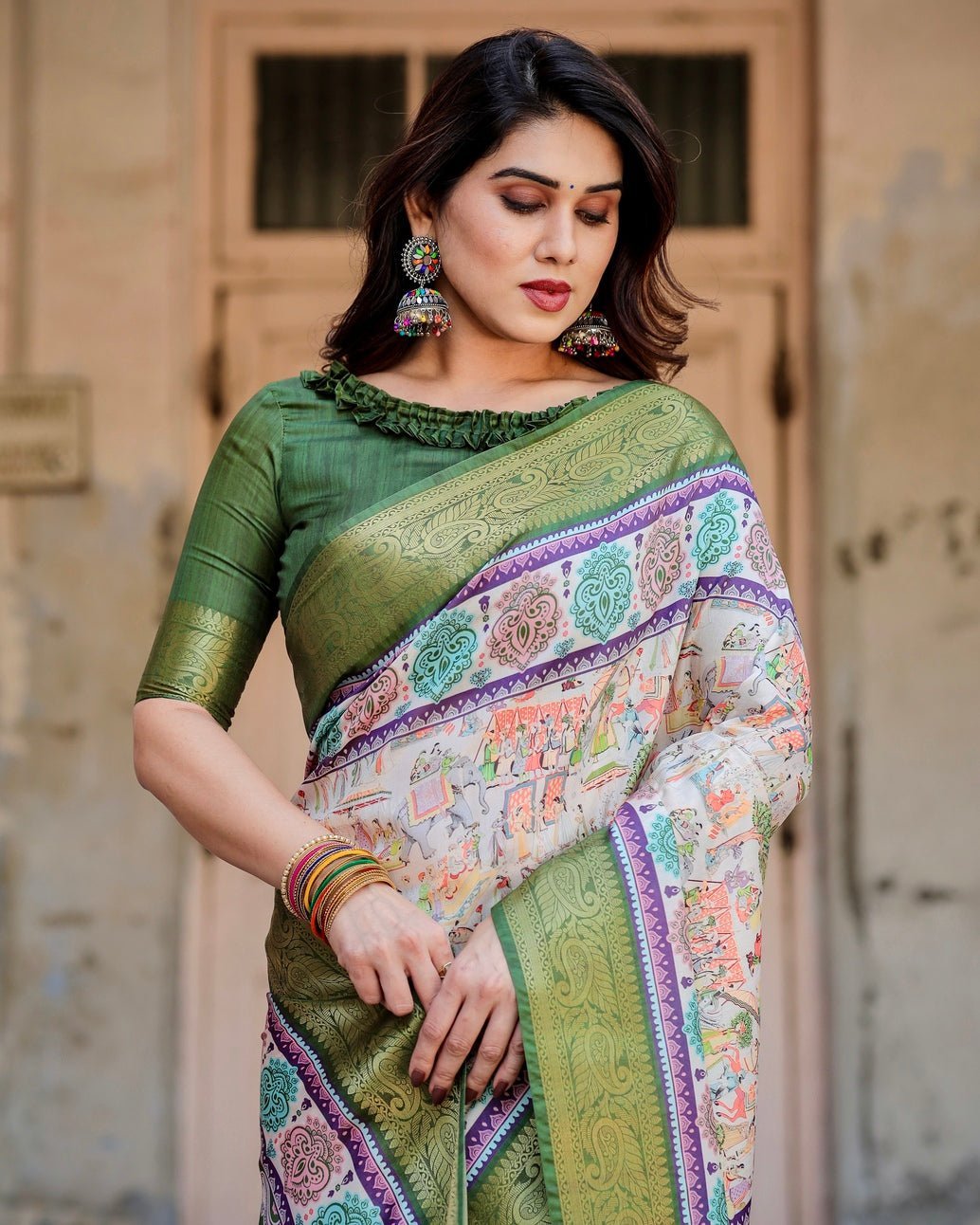Ivory and Green Tussar Silk Saree with Elephant Motifs and Intricate Zari Border