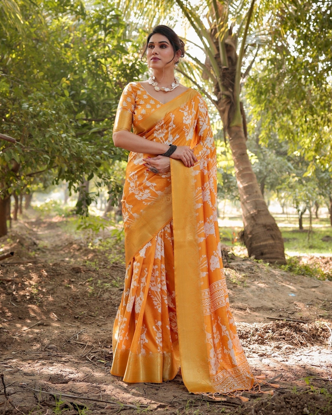 Sunshine Yellow Tussar Silk Saree with White Floral Motifs, Lustrous Zari Border, and Graceful Tassel Pallu