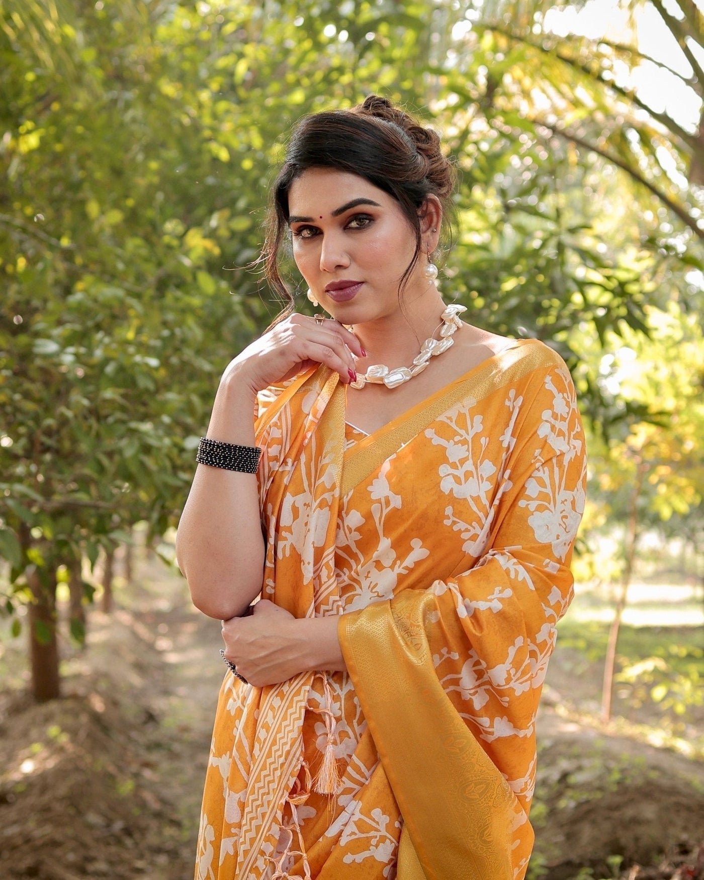 Sunshine Yellow Tussar Silk Saree with White Floral Motifs, Lustrous Zari Border, and Graceful Tassel Pallu