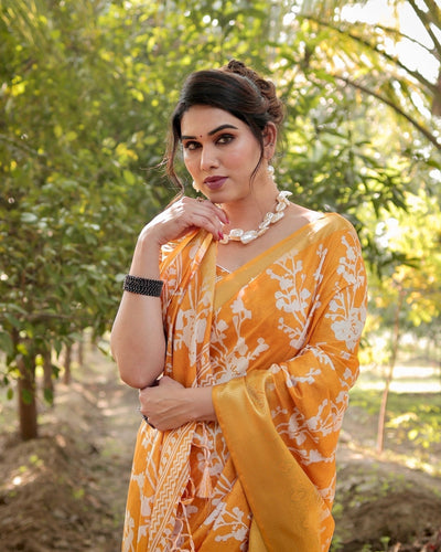 Sunshine Yellow Tussar Silk Saree with White Floral Motifs, Lustrous Zari Border, and Graceful Tassel Pallu