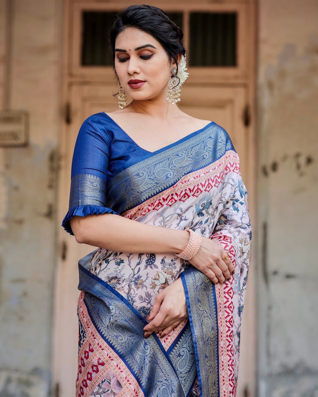 Ivory and Navy Blue Tussar Silk Saree with Floral Elegance and Ornamental Zari Work