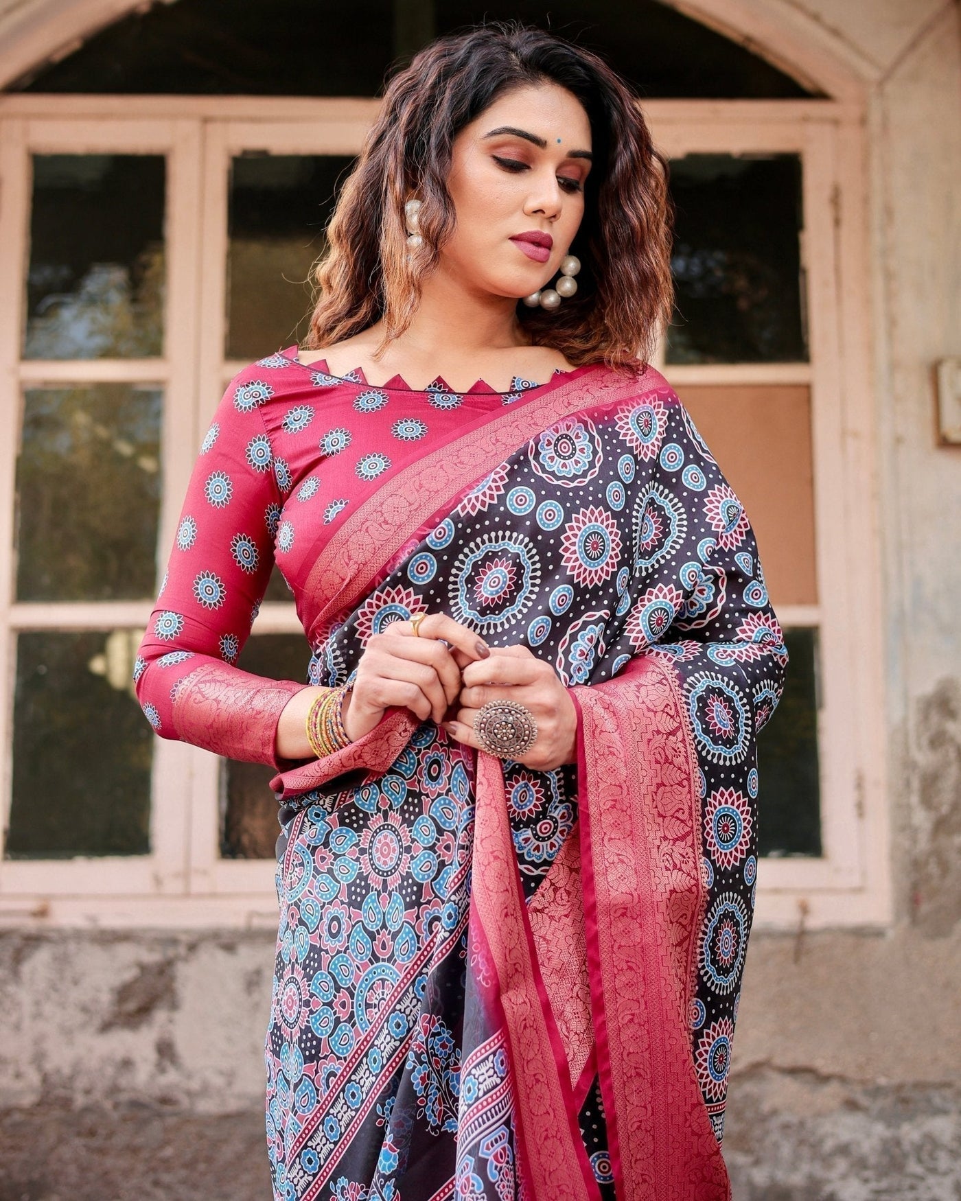 Black and Coral Tussar Silk Saree with Intricate Circular Motifs and Ornamental Pallu