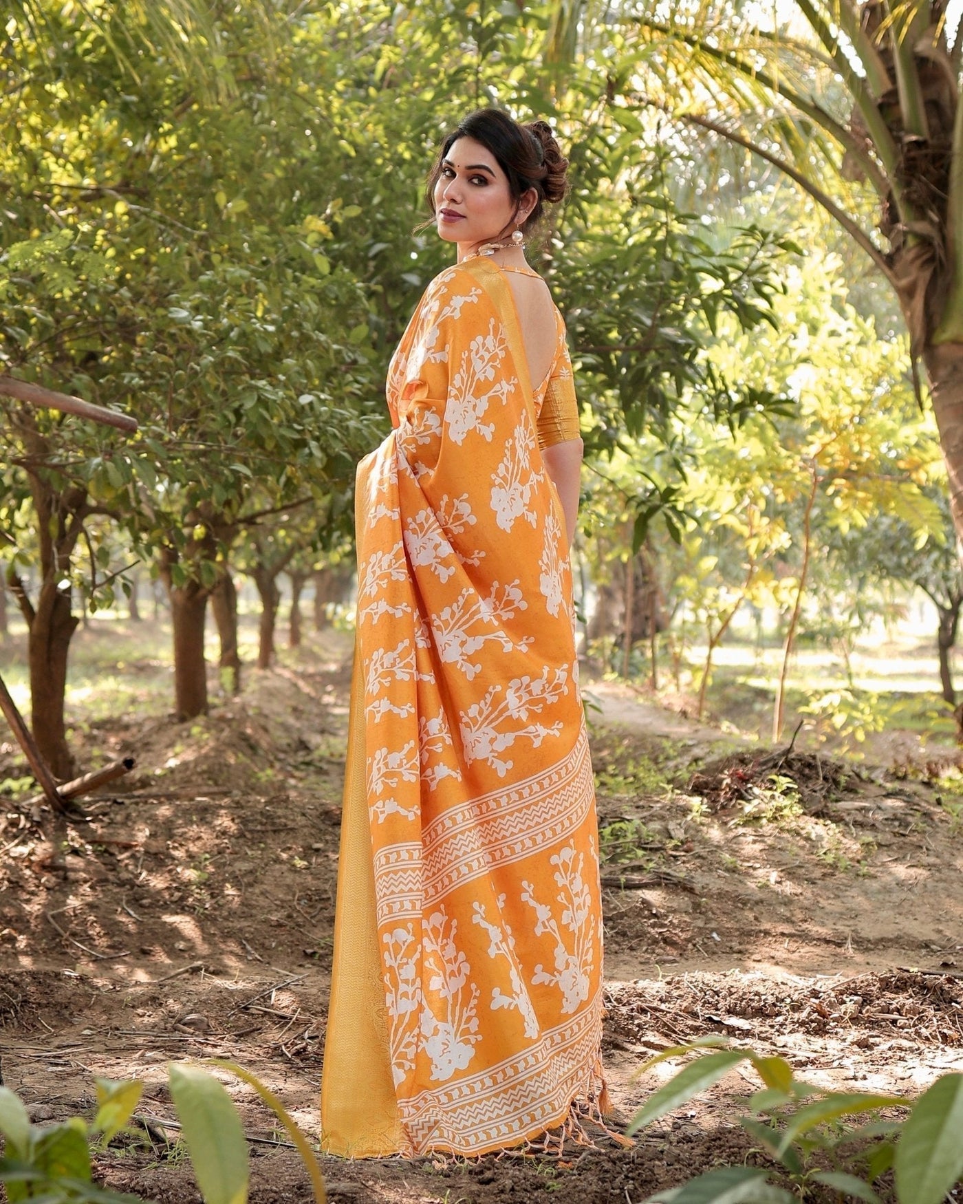 Sunshine Yellow Tussar Silk Saree with White Floral Motifs, Lustrous Zari Border, and Graceful Tassel Pallu