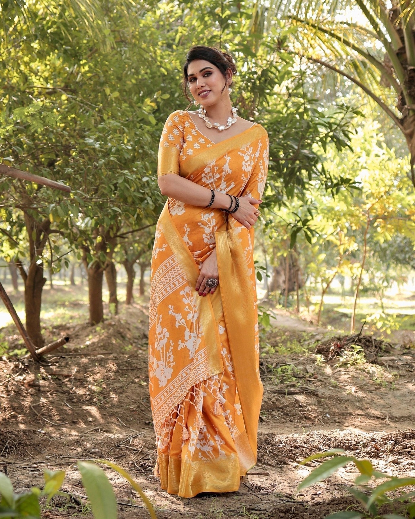 Sunshine Yellow Tussar Silk Saree with White Floral Motifs, Lustrous Zari Border, and Graceful Tassel Pallu