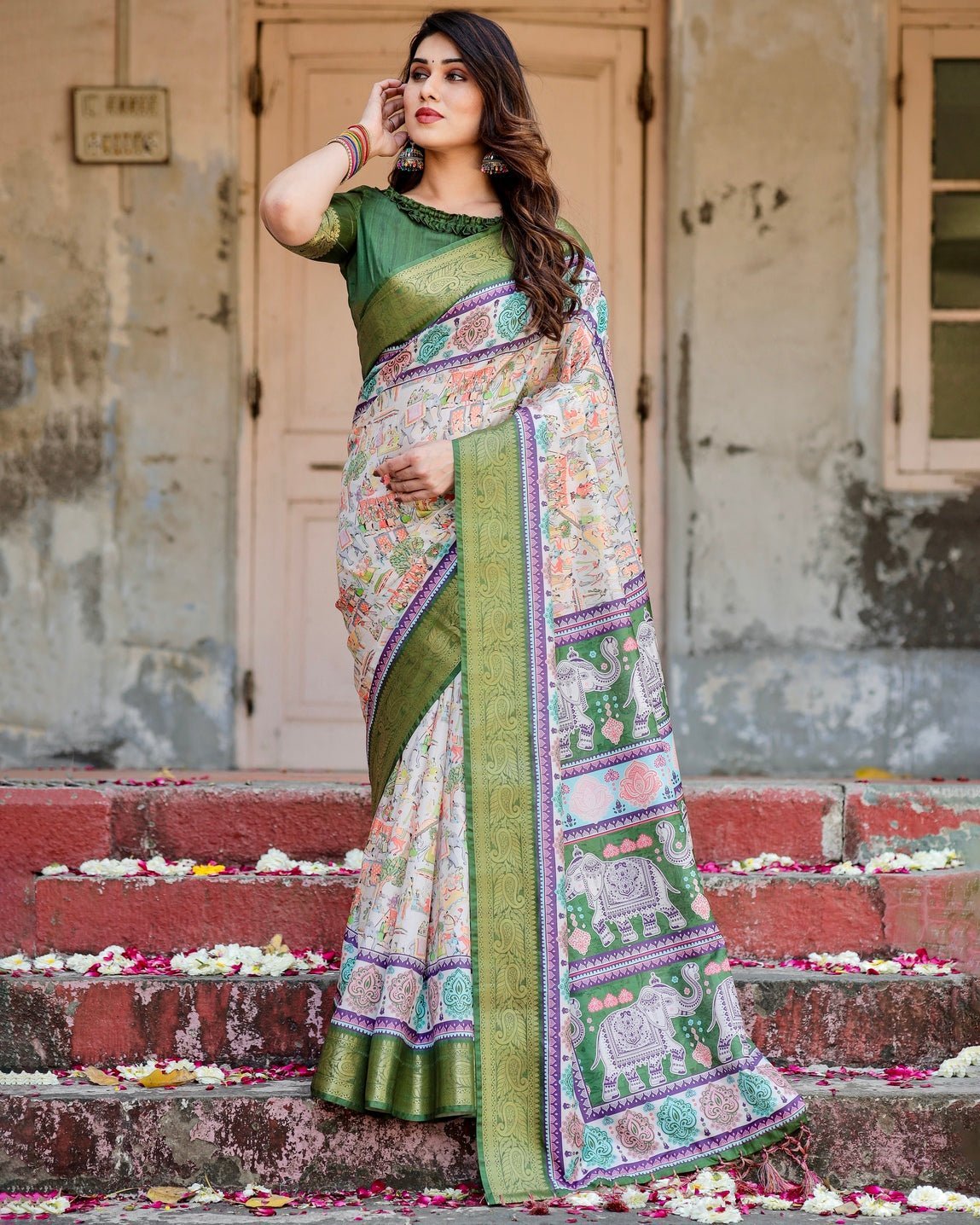 Ivory and Green Tussar Silk Saree with Elephant Motifs and Intricate Zari Border