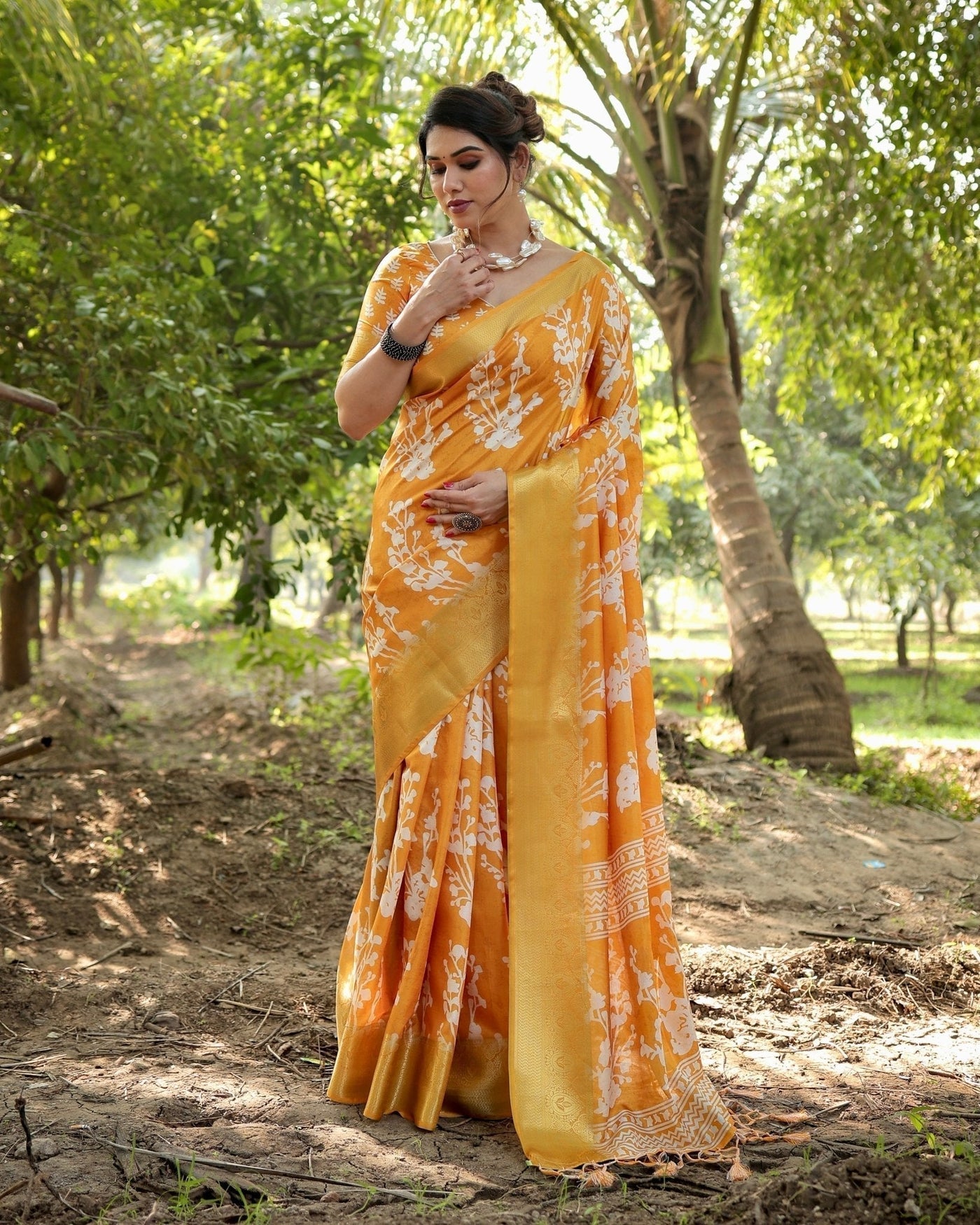 Sunshine Yellow Tussar Silk Saree with White Floral Motifs, Lustrous Zari Border, and Graceful Tassel Pallu