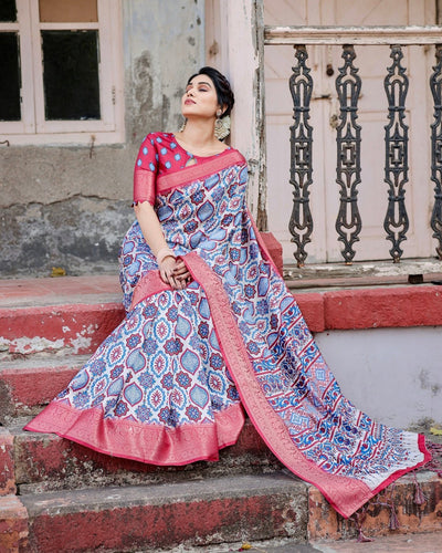 White and Red Tussar Silk Saree with Vibrant Floral Geometric Motifs and Ornamental Zari Border