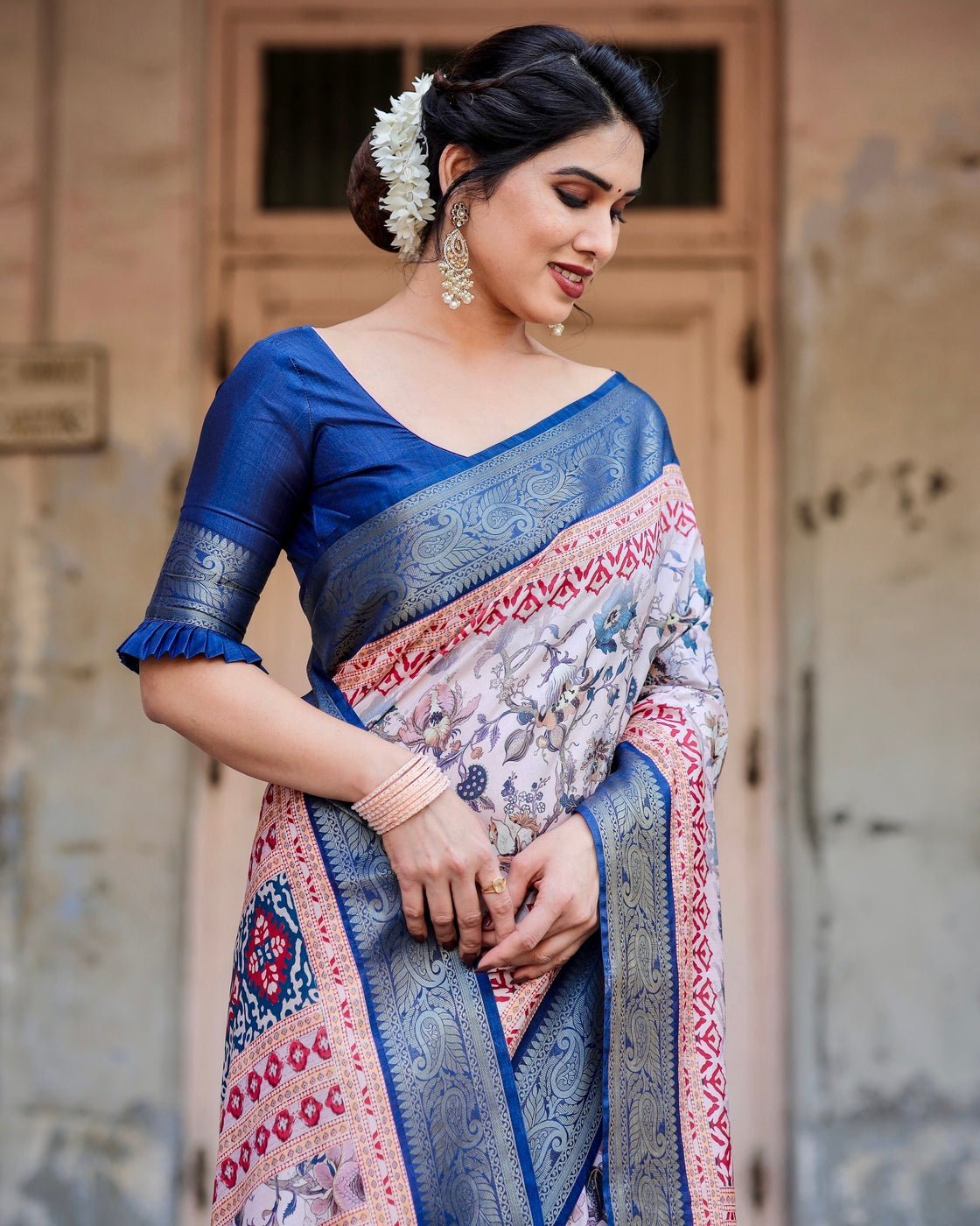 Ivory and Navy Blue Tussar Silk Saree with Floral Elegance and Ornamental Zari Work
