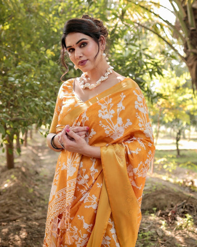 Sunshine Yellow Tussar Silk Saree with White Floral Motifs, Lustrous Zari Border, and Graceful Tassel Pallu