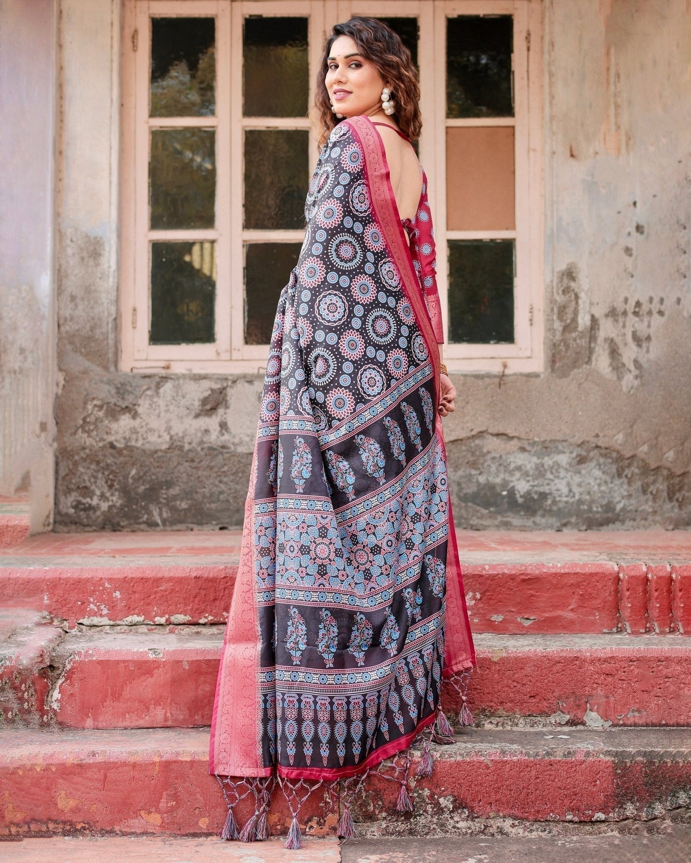 Black and Coral Tussar Silk Saree with Intricate Circular Motifs and Ornamental Pallu
