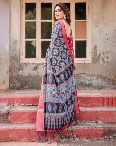 Black and Coral Tussar Silk Saree with Intricate Circular Motifs and Ornamental Pallu