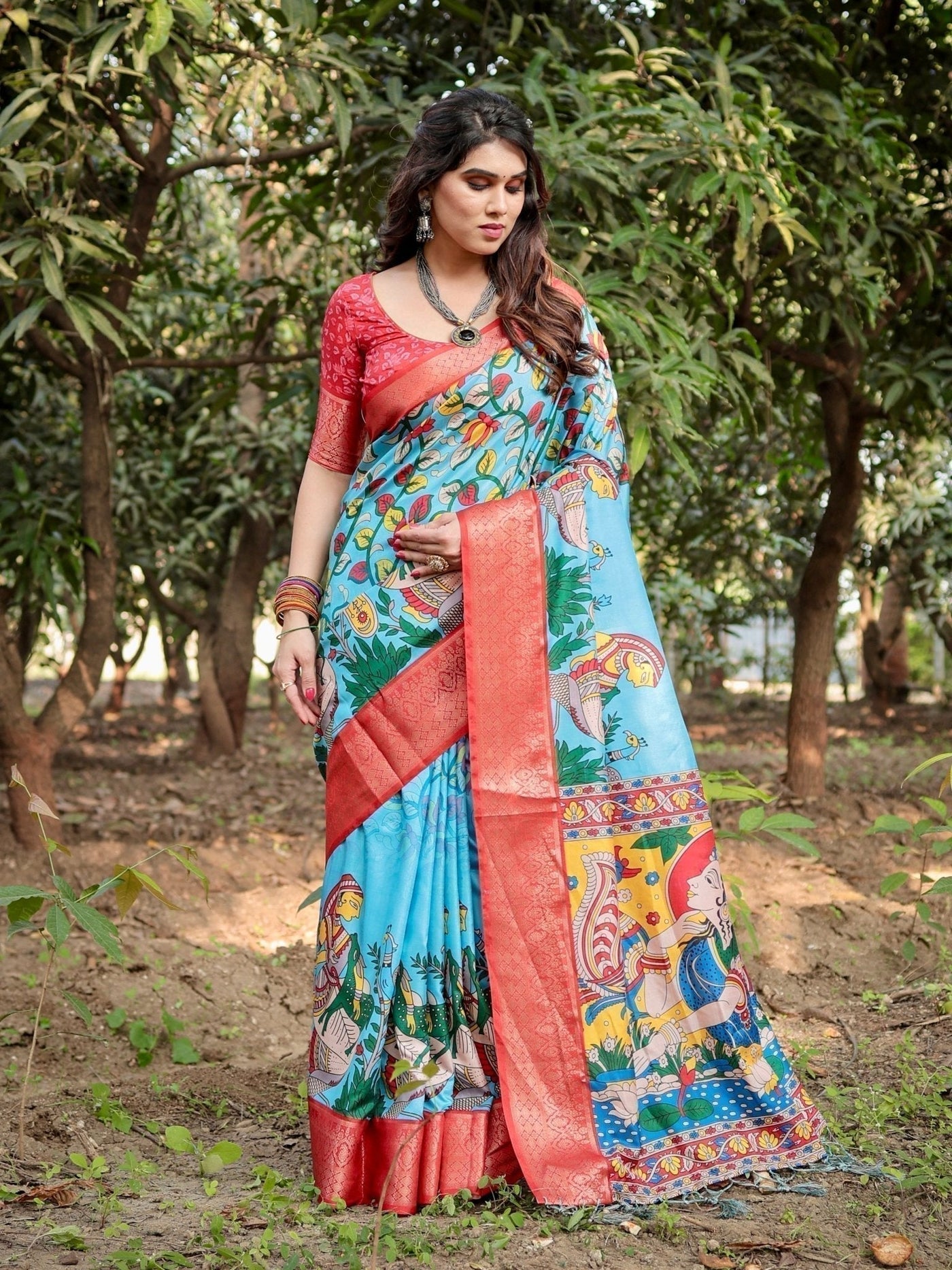 Aqua Blue Tussar Silk Saree with Vibrant Nature-Inspired Prints and Red Zari Border