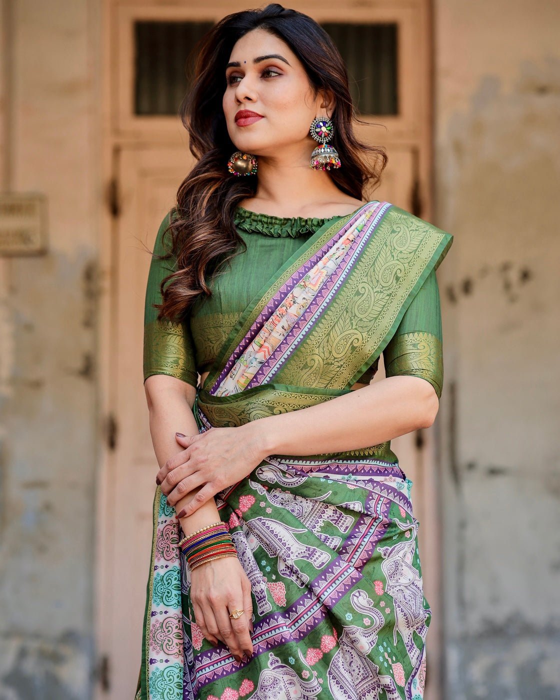 Ivory and Green Tussar Silk Saree with Elephant Motifs and Intricate Zari Border
